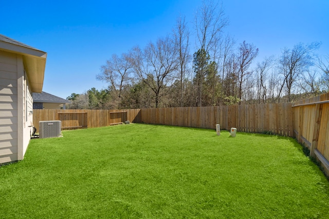9993 Mountain Lion Ln, Magnolia, TX 77354 - view of yard featuring a fenced backyard and cooling unit