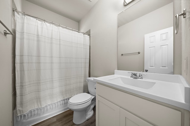 9993 Mountain Lion Ln, Magnolia, TX 77354 - bathroom with wood finished floors, toilet, vanity, and shower / tub combo with curtain