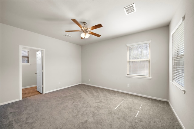 9993 Mountain Lion Ln, Magnolia, TX 77354 - unfurnished bedroom with carpet, visible vents, and multiple windows