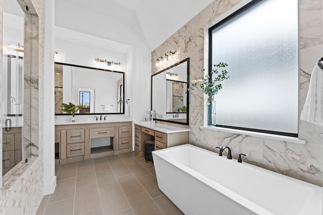 full bathroom featuring a freestanding bath, a stall shower, and plenty of natural light