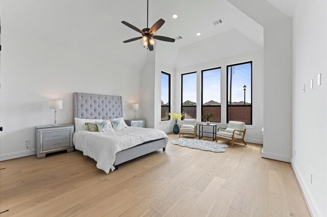 bedroom featuring light wood-style flooring, visible vents, baseboards, recessed lighting, and a ceiling fan