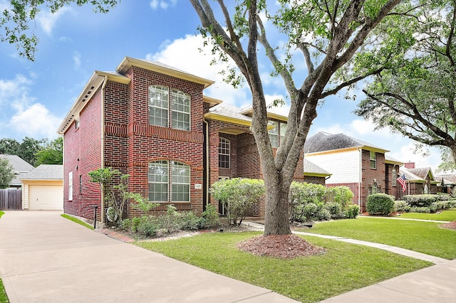 5127 Plantation Colony Dr, Sugar Land, TX 77478 - view of front of property featuring brick siding, a front lawn, and a detached garage