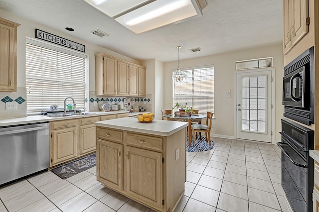 5127 Plantation Colony Dr, Sugar Land, TX 77478 - kitchen with black appliances, light brown cabinets, a sink, and backsplash