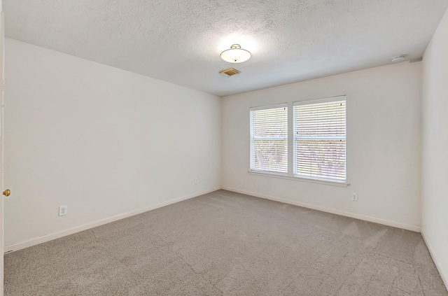 5127 Plantation Colony Dr, Sugar Land, TX 77478 - unfurnished room with carpet floors, baseboards, a smoke detector, and a textured ceiling