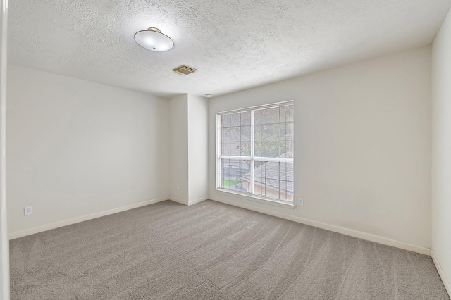 5127 Plantation Colony Dr, Sugar Land, TX 77478 - empty room featuring carpet flooring, a textured ceiling, and baseboards