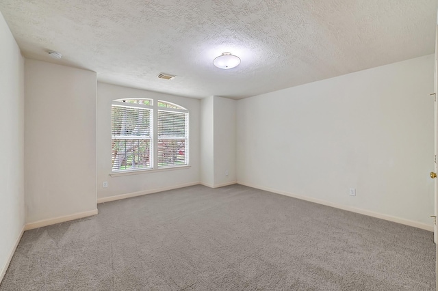 5127 Plantation Colony Dr, Sugar Land, TX 77478 - unfurnished room featuring carpet flooring, a textured ceiling, baseboards, and a smoke detector