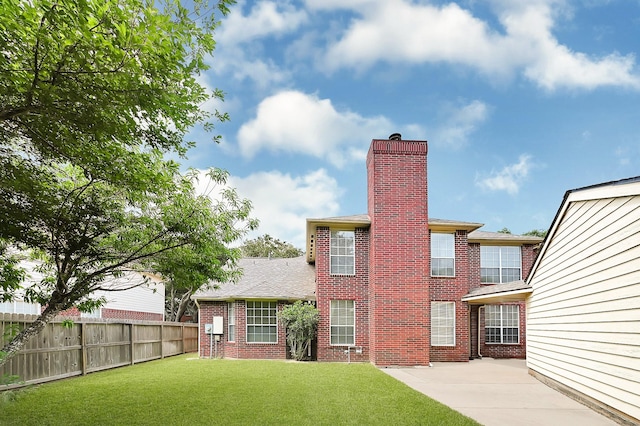 5127 Plantation Colony Dr, Sugar Land, TX 77478 - rear view of property with brick siding, a chimney, and a patio