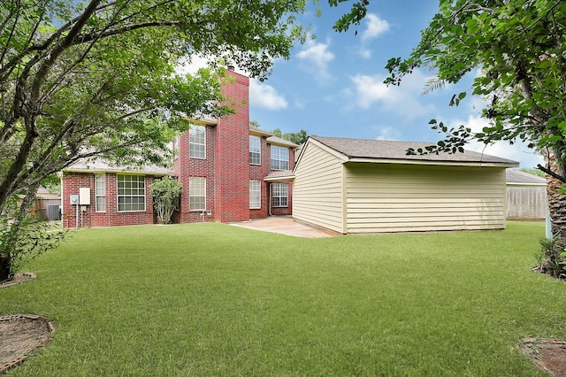 5127 Plantation Colony Dr, Sugar Land, TX 77478 - rear view of house with brick siding, a chimney, a patio, and central AC