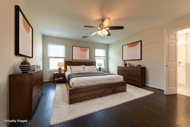 bedroom featuring baseboards, visible vents, ceiling fan, and dark wood-type flooring