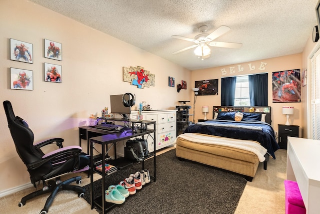 bedroom with carpet, ceiling fan, and a textured ceiling