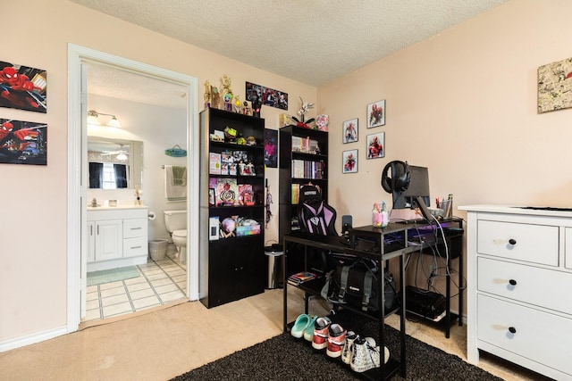 office with a textured ceiling and light colored carpet