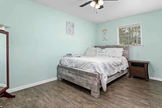 343 Pinemont Dr, Sour Lake, TX 77659 - bedroom with ceiling fan, wood finished floors, and baseboards