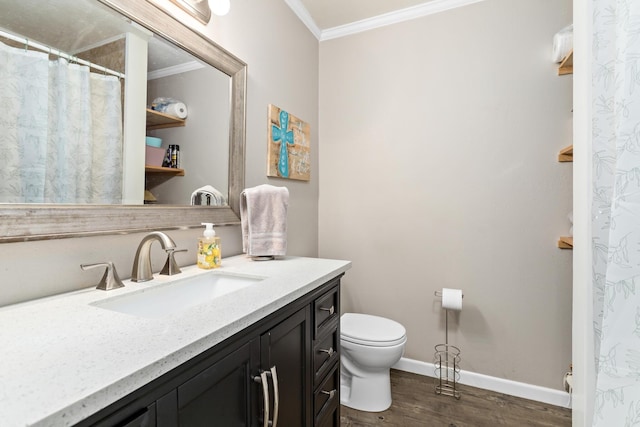 343 Pinemont Dr, Sour Lake, TX 77659 - full bath with wood finished floors, toilet, vanity, baseboards, and crown molding