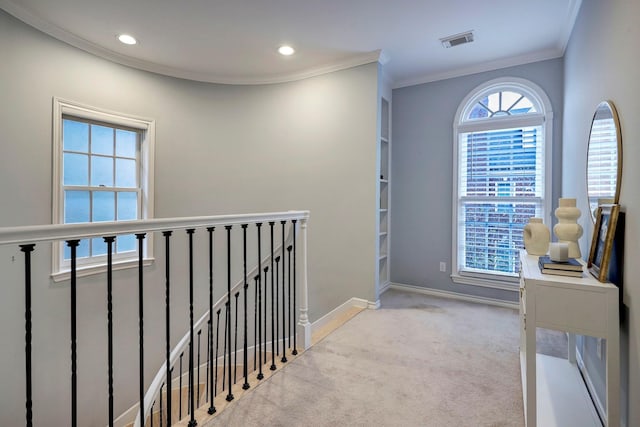 hallway featuring crown molding, carpet floors, recessed lighting, an upstairs landing, and visible vents