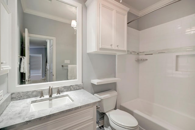 bathroom featuring crown molding, toilet, shower / bathtub combination, and vanity
