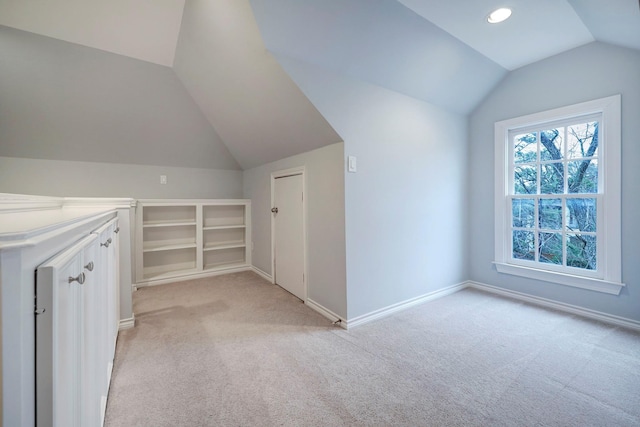 bonus room with light colored carpet, recessed lighting, baseboards, and lofted ceiling