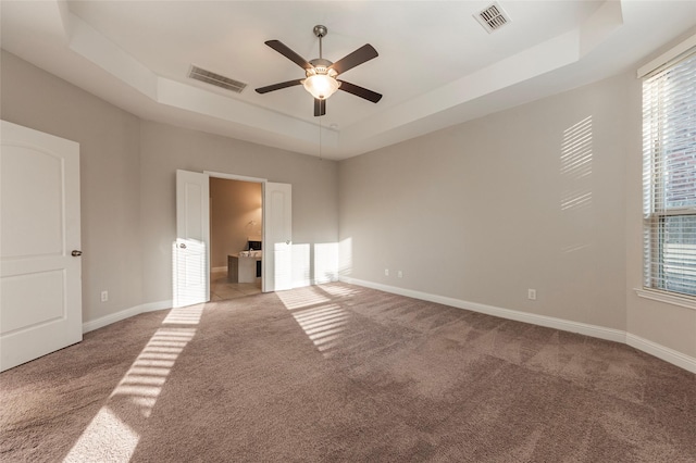 3302 Indigo Acres Ct, Katy, TX 77494 - spare room with visible vents, a raised ceiling, ceiling fan, and carpet floors