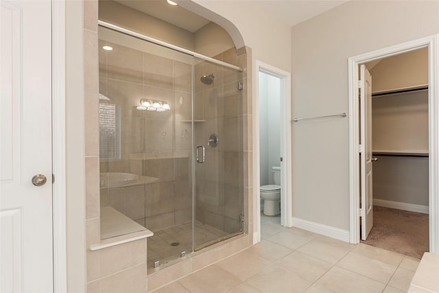 3302 Indigo Acres Ct, Katy, TX 77494 - bathroom with a stall shower, toilet, and tile patterned flooring
