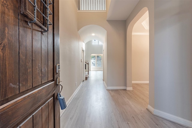 3302 Indigo Acres Ct, Katy, TX 77494 - entrance foyer featuring light wood-style floors, baseboards, and arched walkways