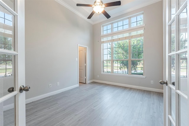 3302 Indigo Acres Ct, Katy, TX 77494 - unfurnished room with baseboards, a wealth of natural light, a high ceiling, and crown molding