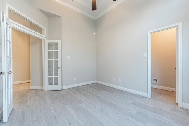 3302 Indigo Acres Ct, Katy, TX 77494 - empty room with ornamental molding, light wood finished floors, baseboards, a ceiling fan, and french doors