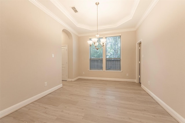 3302 Indigo Acres Ct, Katy, TX 77494 - unfurnished room with visible vents, a tray ceiling, arched walkways, light wood finished floors, and a notable chandelier