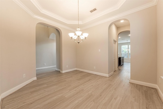 3302 Indigo Acres Ct, Katy, TX 77494 - empty room with arched walkways, visible vents, an inviting chandelier, and a raised ceiling