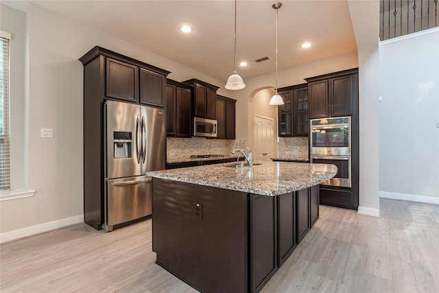 3302 Indigo Acres Ct, Katy, TX 77494 - kitchen featuring baseboards, stainless steel appliances, and light wood finished floors