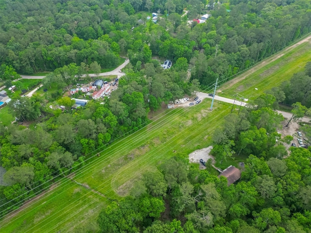 drone / aerial view with a view of trees