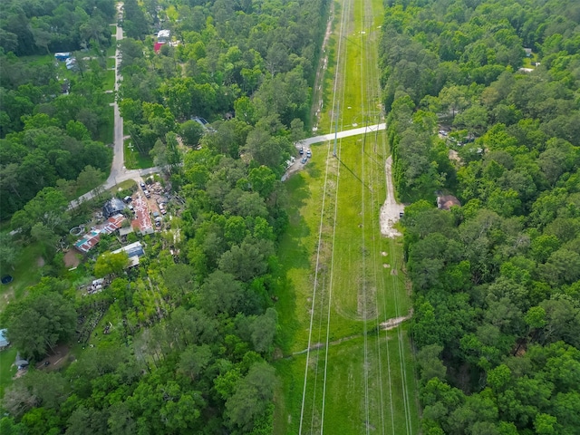 birds eye view of property with a wooded view