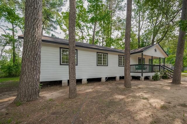 exterior space featuring a wooden deck