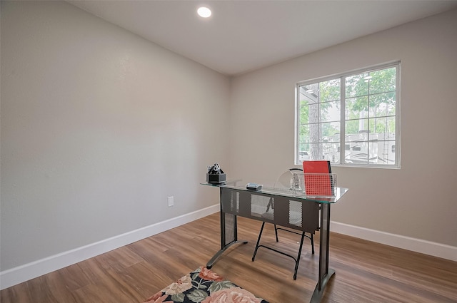 office space featuring wood finished floors, recessed lighting, and baseboards