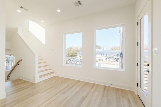 foyer featuring recessed lighting, baseboards, visible vents, and light wood-style flooring