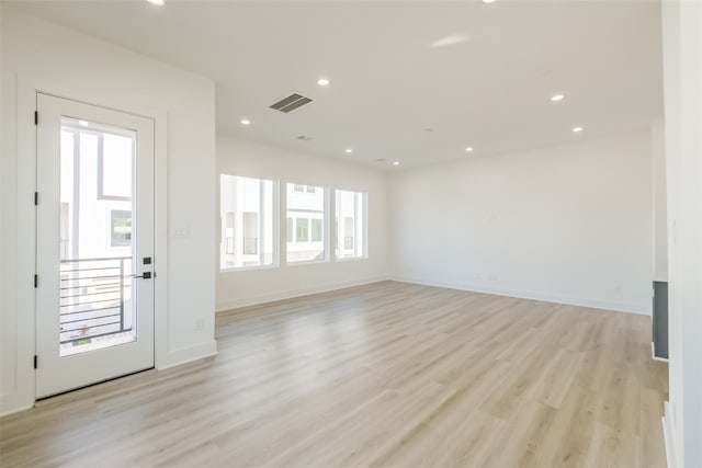 interior space featuring baseboards, recessed lighting, light wood-style flooring, and visible vents