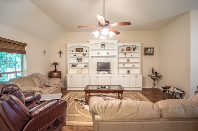 living area with ceiling fan, wood finished floors, and vaulted ceiling