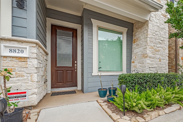 8820 Ashbloom Ln, Houston, TX 77080 - view of exterior entry featuring stone siding