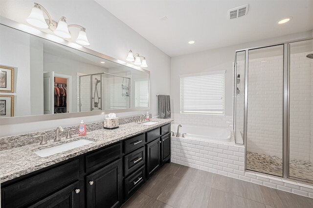 8820 Ashbloom Ln, Houston, TX 77080 - full bath with a shower stall, a garden tub, double vanity, a spacious closet, and recessed lighting