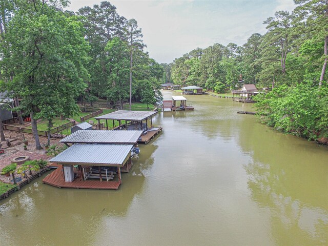 70 Lower Cove Dr, Point Blank, TX 77364 - dock area featuring boat lift and a water view