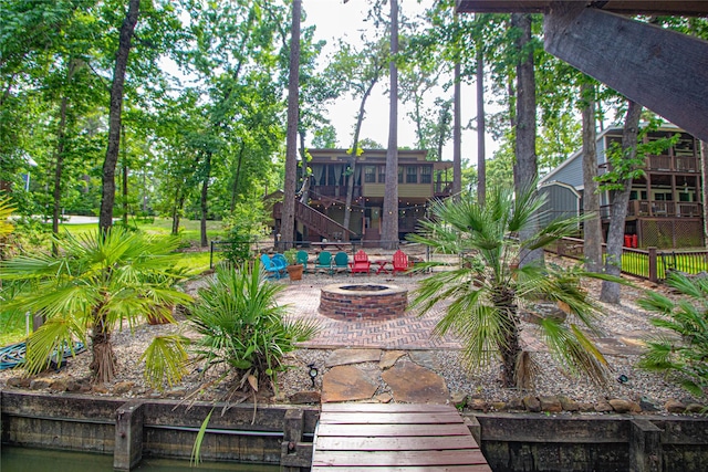 70 Lower Cove Dr, Point Blank, TX 77364 - view of yard featuring an outdoor fire pit, stairway, and a patio area