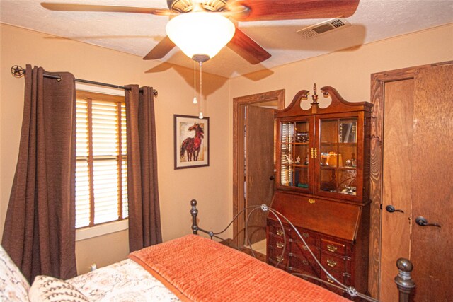 70 Lower Cove Dr, Point Blank, TX 77364 - bedroom with multiple windows and ceiling fan