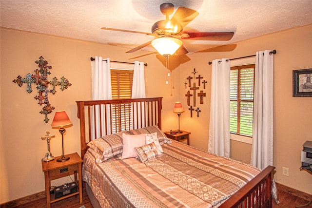 70 Lower Cove Dr, Point Blank, TX 77364 - bedroom with wood finished floors, baseboards, a textured ceiling, and ceiling fan
