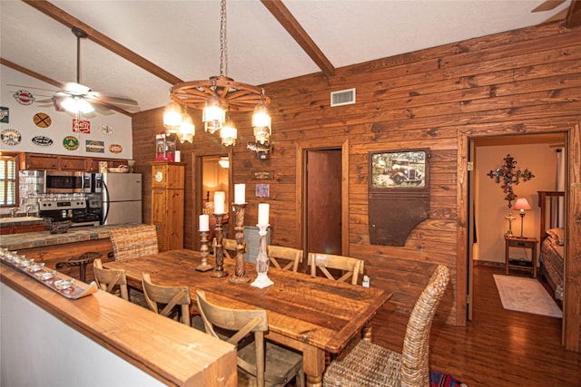 70 Lower Cove Dr, Point Blank, TX 77364 - dining area featuring wood walls, ceiling fan, beamed ceiling, dark wood-style floors, and high vaulted ceiling