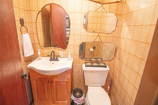 70 Lower Cove Dr, Point Blank, TX 77364 - half bathroom with vanity, toilet, and tile walls
