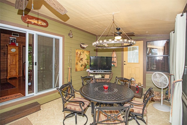 70 Lower Cove Dr, Point Blank, TX 77364 - dining area featuring wooden walls and a chandelier