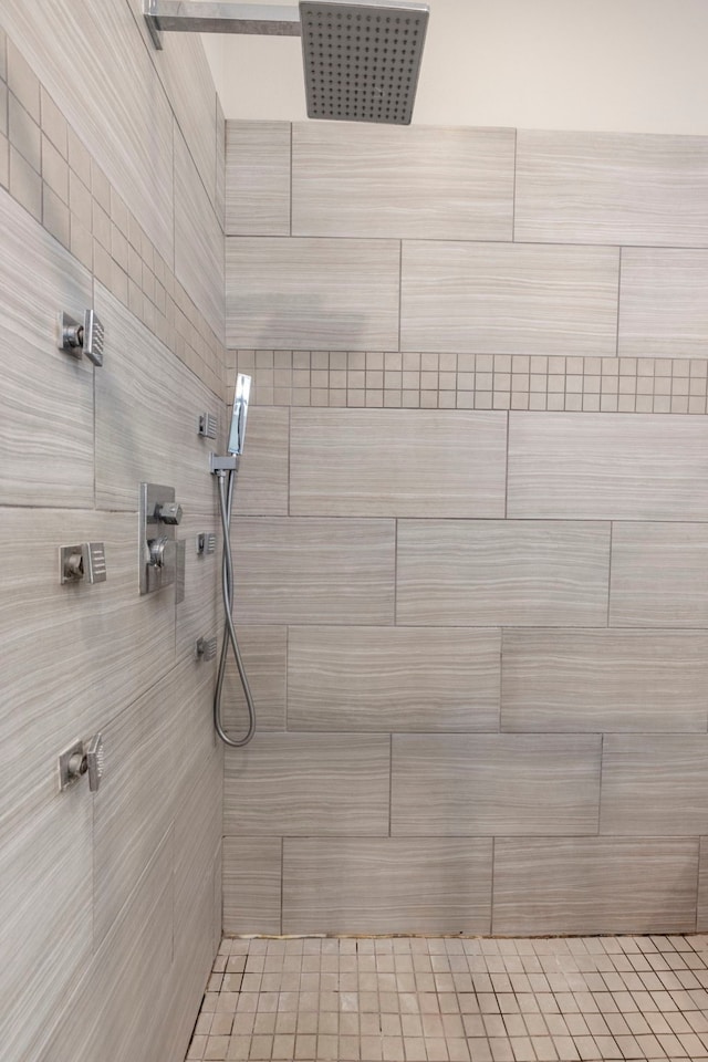 bathroom with tiled shower