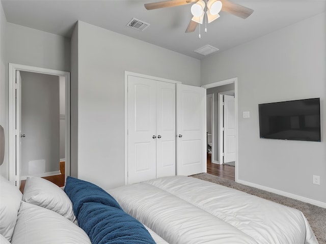 2921 4th St, Bay City, TX 77414 - carpeted bedroom featuring a closet, baseboards, and ceiling fan
