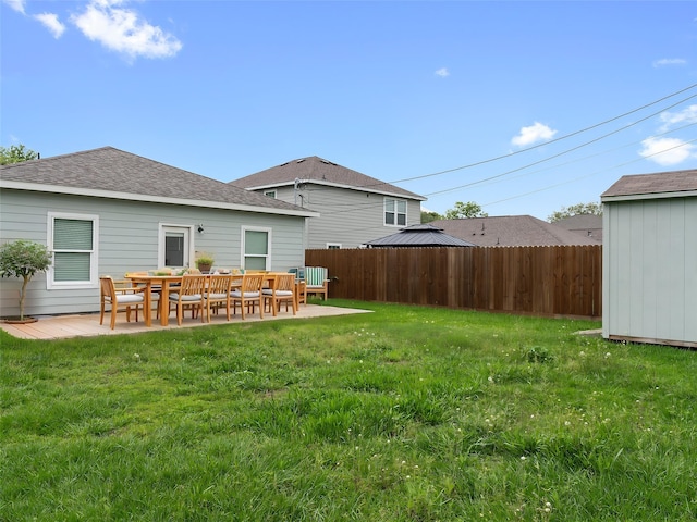 2921 4th St, Bay City, TX 77414 - back of property with roof with shingles and a patio area