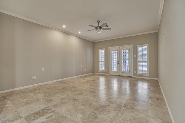 spare room with baseboards, ornamental molding, ceiling fan, and french doors