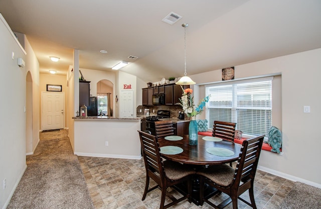 10255 Scenic Vista Dr, Humble, TX 77396 - dining space featuring arched walkways, visible vents, and baseboards