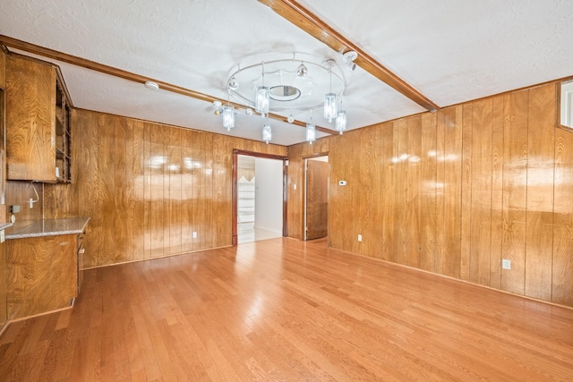 7718 Pella Dr, Houston, TX 77036 - spare room featuring wood walls and wood finished floors